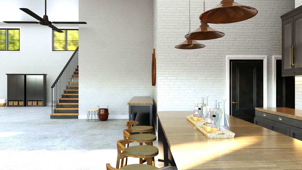 Interior rendering of a kitchen with white brick walls, a large island, and an open staircase leading to a loft area with storage cabinets.