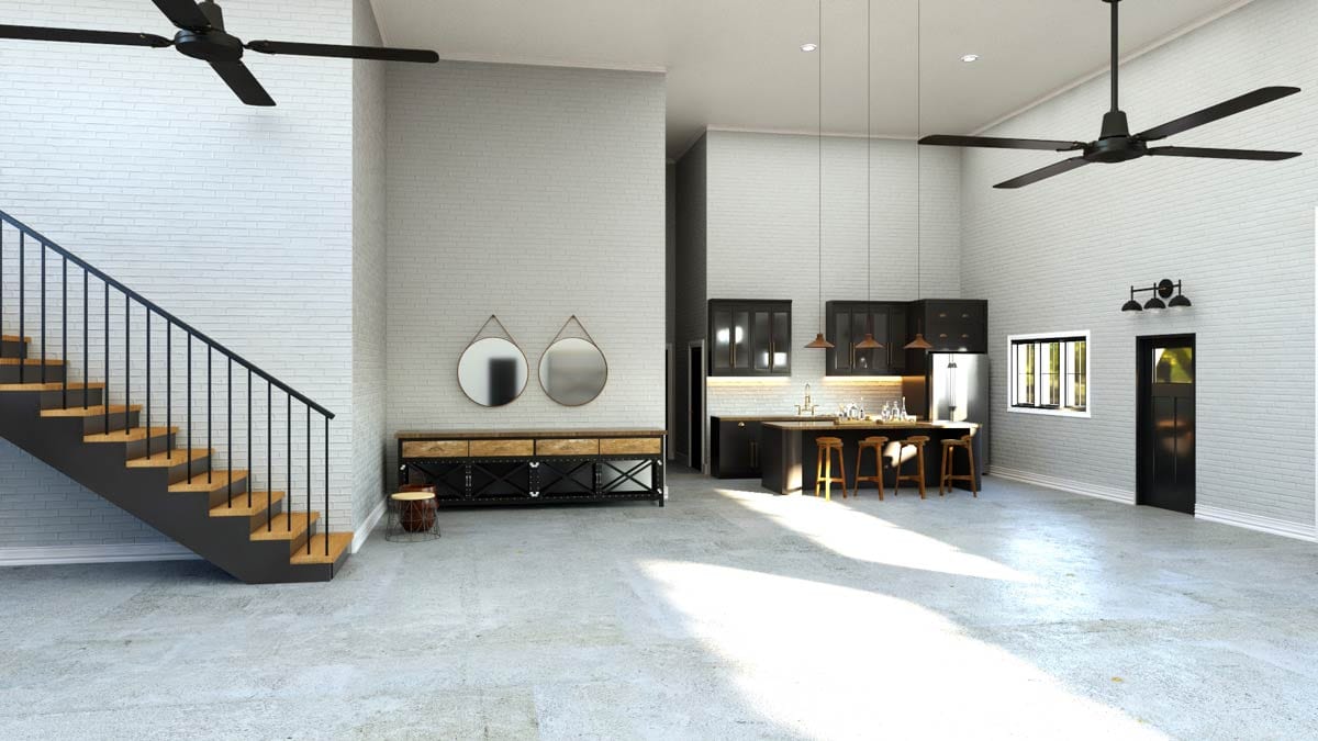 Open concept living area with stairs, kitchen island, and vaulted ceiling with ceiling fans.